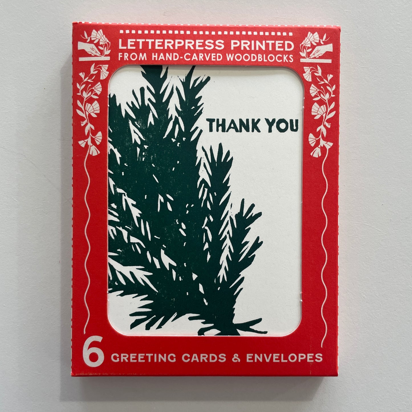 A boxed set of 6 greeting cards and envelopes with a rosemary design and the text 'Thank You' on the front of the cards.