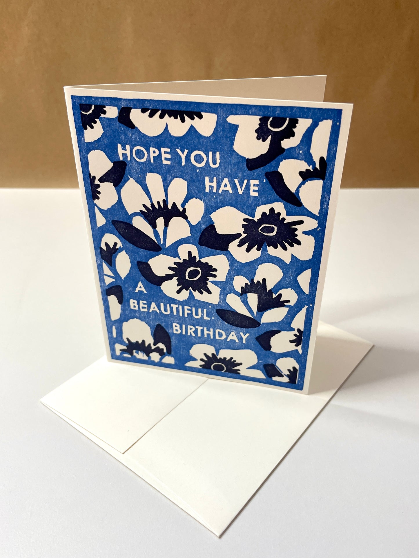 Blue and white floral greeting card with text “Hope you have a beautiful birthday”