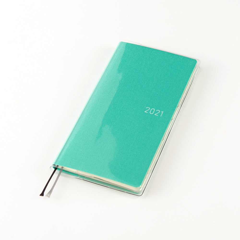 A 2021 pocket planner with a textured mint green cover, shown closed with a black ribbon bookmark on a clean white background.