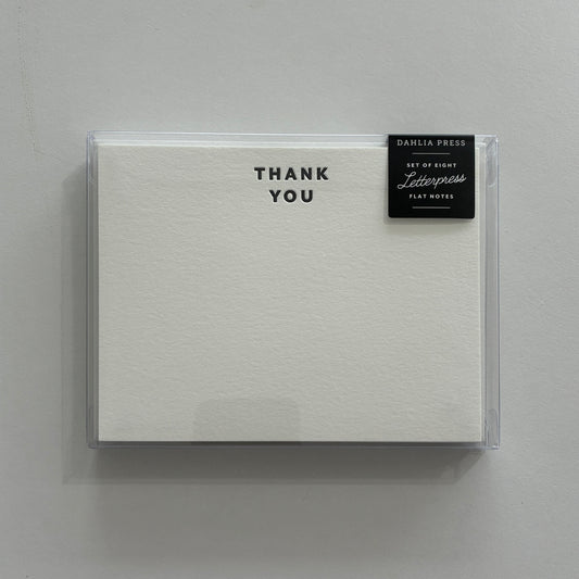 Box of letterpress flat notes with 'Thank You' text on a gray background