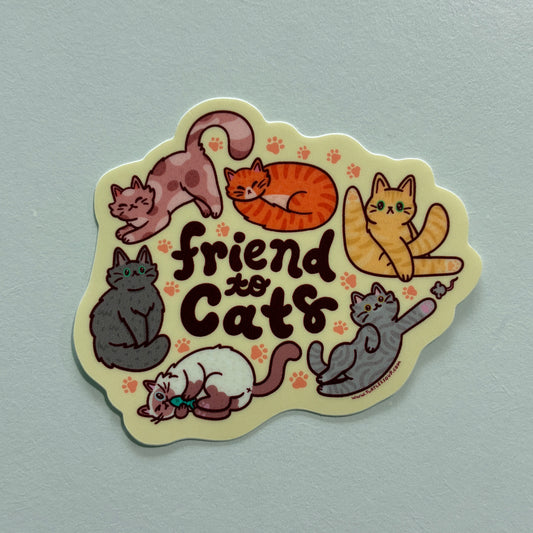 A sticker with several cat illustrations and text saying “friend to cats” on a gray background