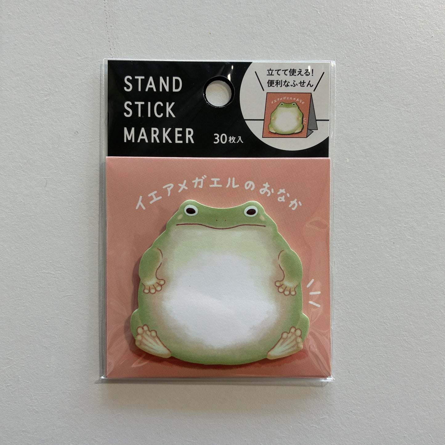 Stand stick marker with frog design on a pink background