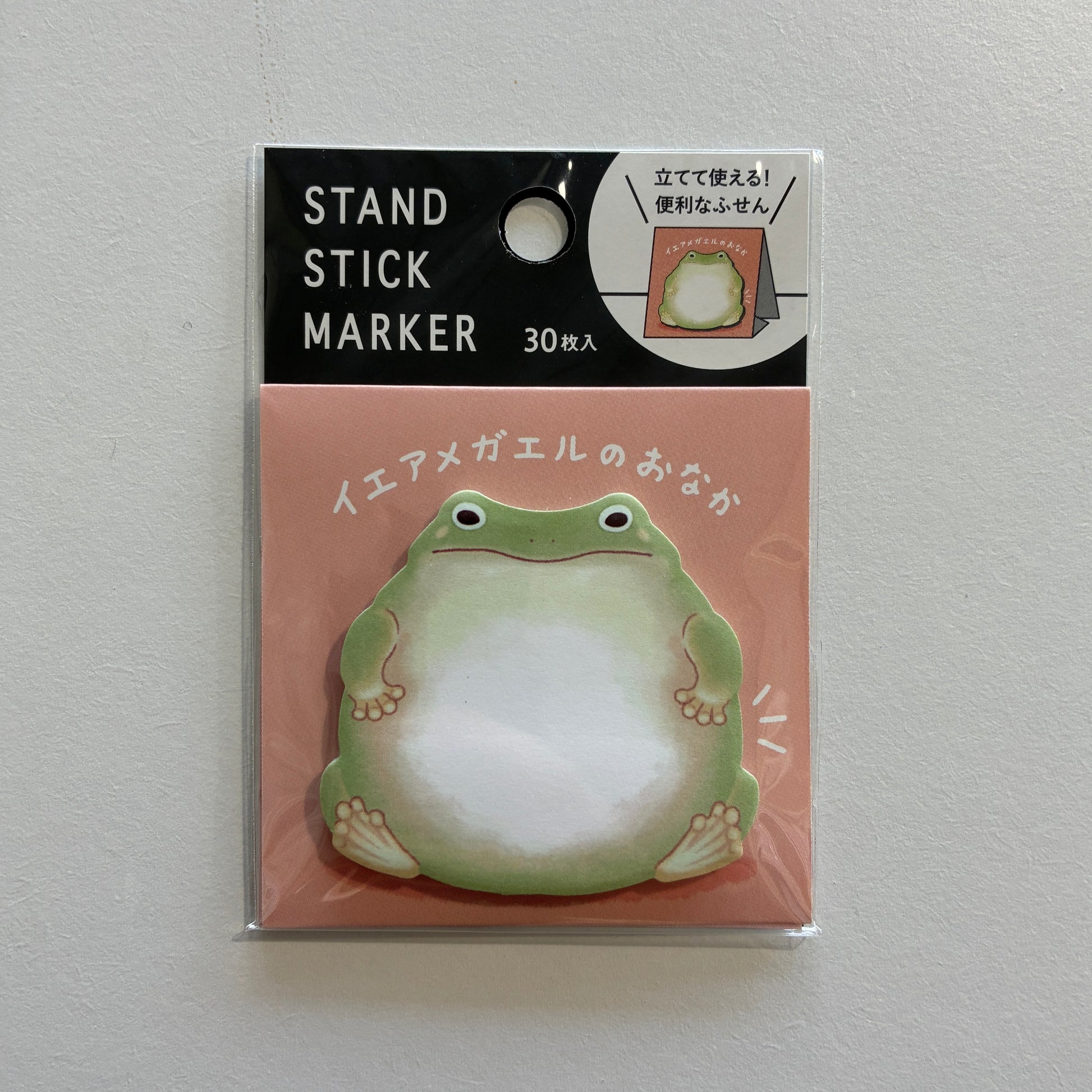 Stand stick marker with frog design on a pink background
