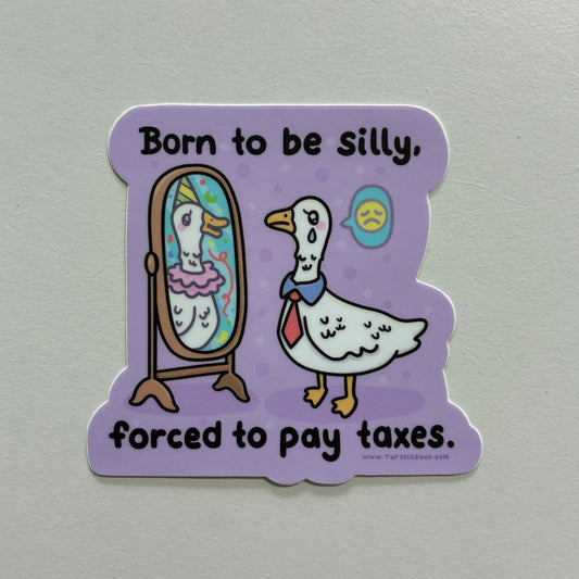 A sticker with a goose drawing and text that says “born to be silly, forced to pay taxes” on a gray background