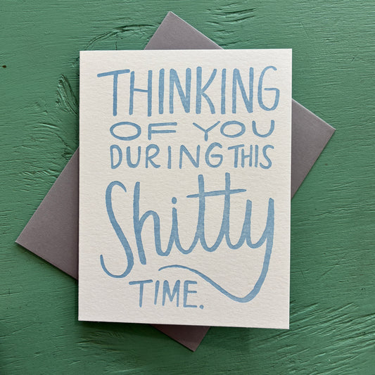 Card with blue text 'Thinking of you during this shitty time' on a green background