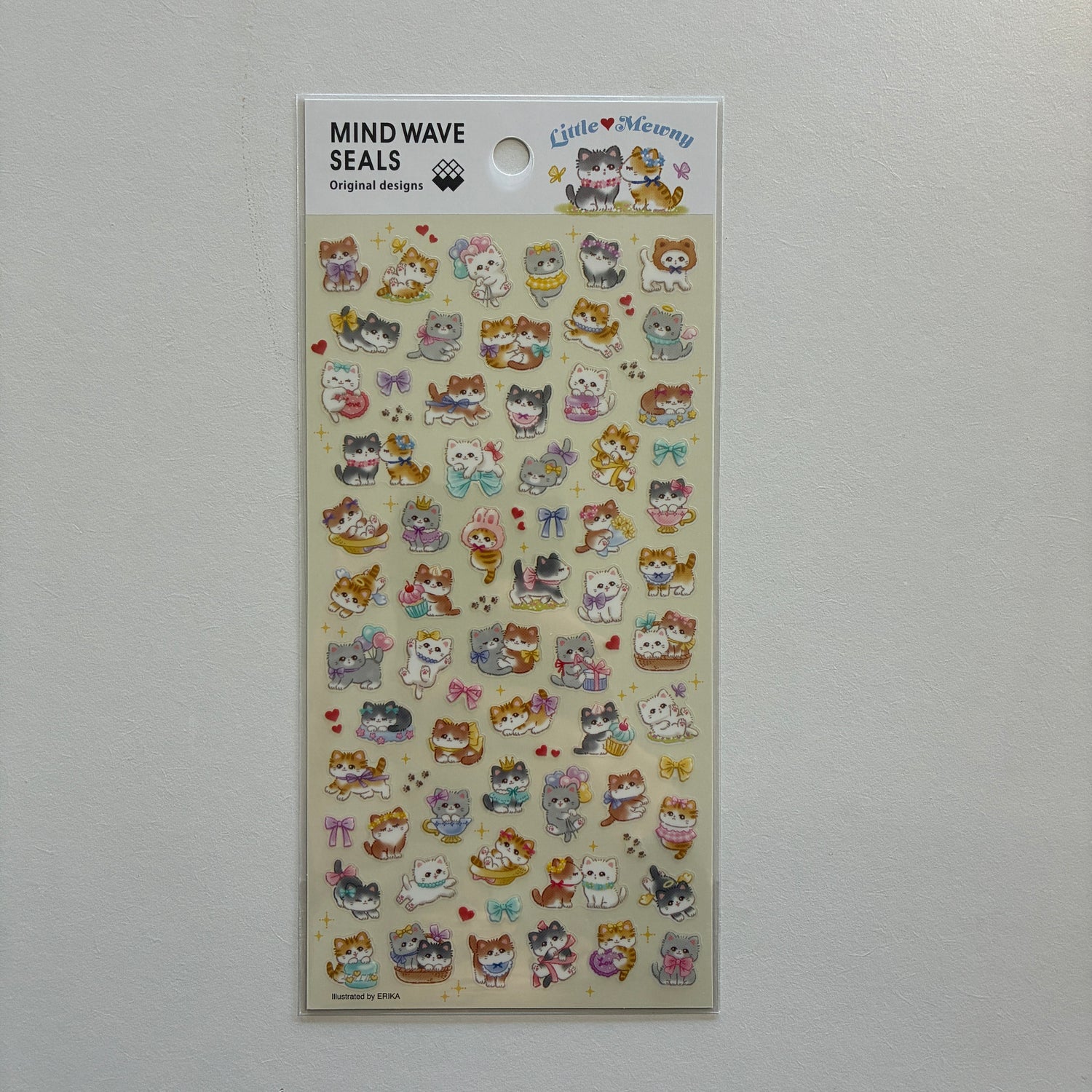 Sheet of decorative stickers with cartoon cats on a gray background