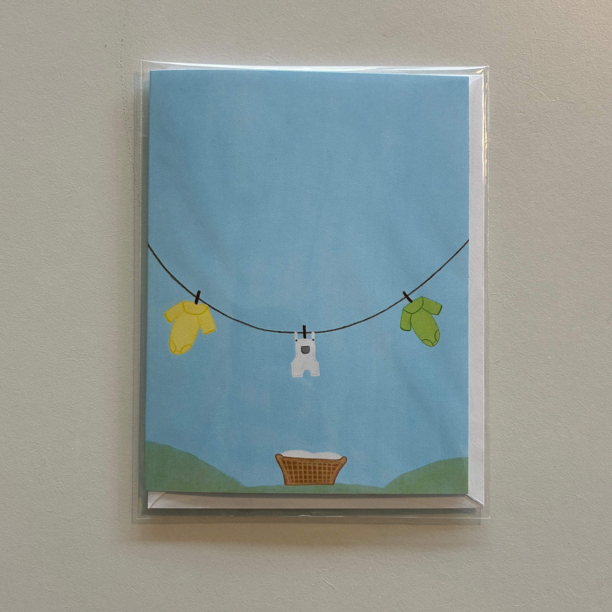 Illustration of baby onesies hanging on a clothesline