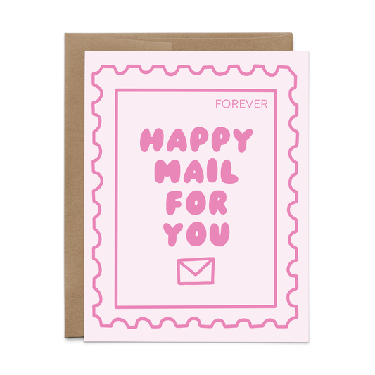A pink greeting card with a postage stamp border and the words 'FOREVER HAPPY MAIL FOR YOU' in pink lettering, shown with a brown envelope behind it on a white background.