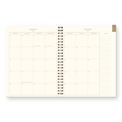 Calendar planner with monthly view on a white background