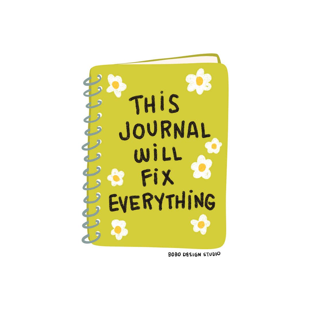 Yellow journal with floral designs and text on a white background