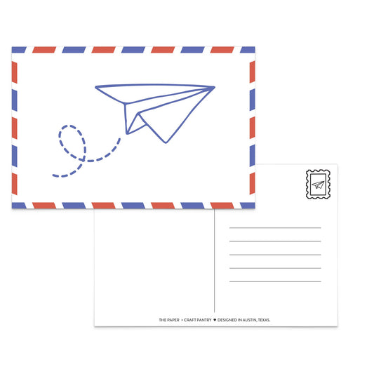 A postcard set featuring a front design with a blue paper airplane line drawing inside a red and blue striped border, and a back view with writing lines and a postage stamp illustration.