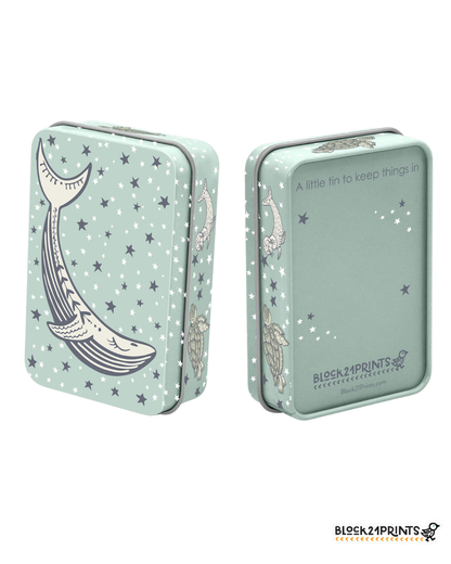 Two mint green tins with star patterns and whale illustrations on a white background.